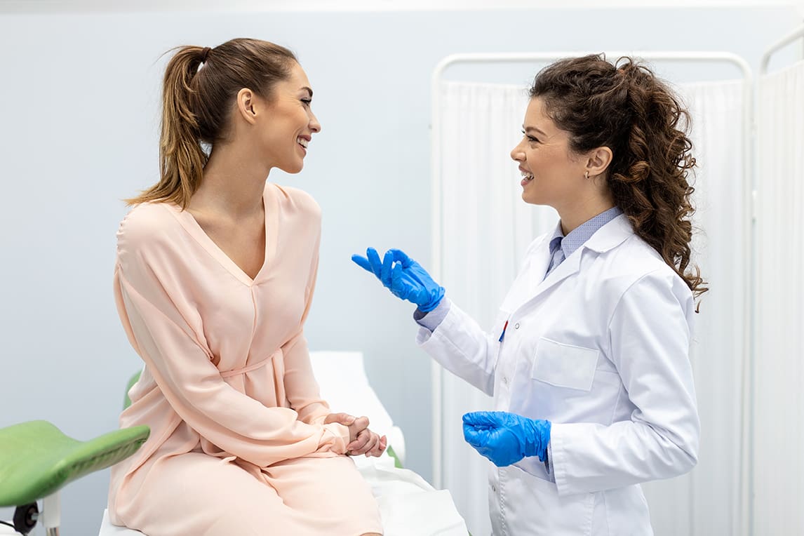 woman talking with her Gynecologist regarding vaginal health