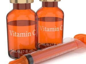 vitamin C glass bottles with a syringe